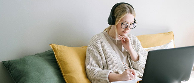 Teen girl studying on her laptop.