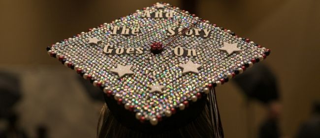 Graduation cap with text that says 