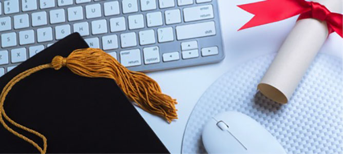 Graduation cap, diploma with ribbon, computer mouse, and keyboard.