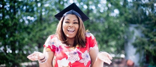 Girl wearing graduation cap outside